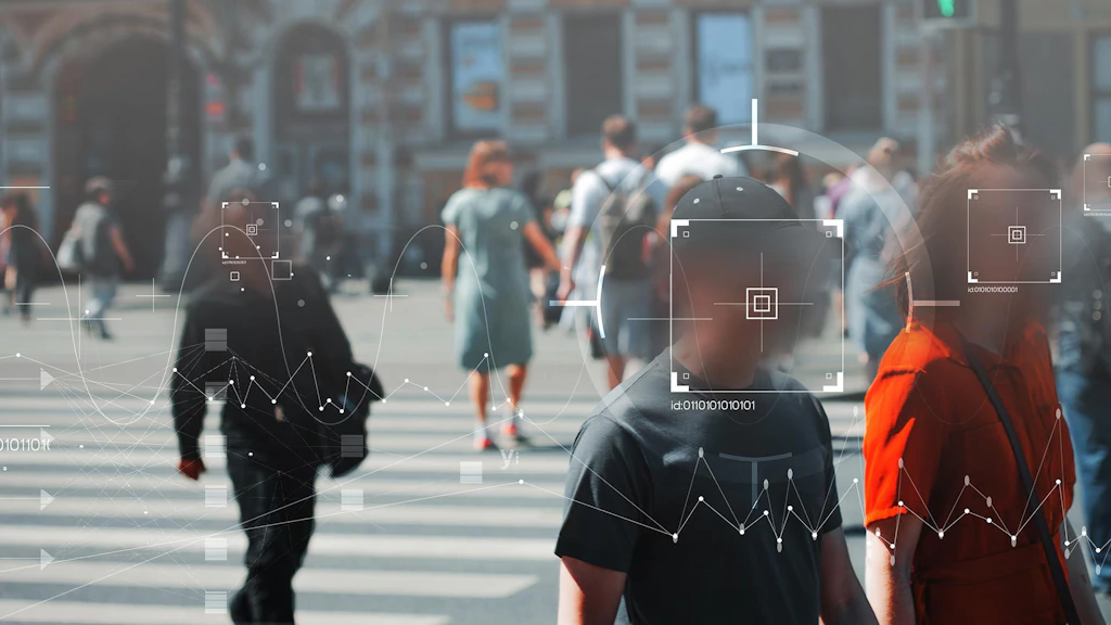 Cette image symbolise les technologies de reconnaissance faciale et d'identification des personnes utilisées dans les caméras de vidéosurveillance et dans le cadre des poursuites pénales.